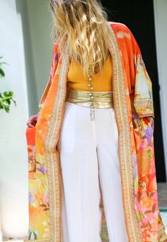 If you love kimonos, flowers, the color orange and mermaids this kimono has your name on it! A  beautifully designed with free flowing winged arms with an intrigue inspired mermaid theme. Three-quarter inch flare sleeves. Poly blend.   SizeSleeveBustLengthShoulder S3213013463 M3213413564 L3213813665 Kimono Kaftan, The Color Orange, 2piece Outfits, Bohemian Kimono, Sew Patterns, Orange Satin, Satin Kimono, Orange Outfit, Mermaid Inspired