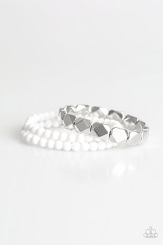 A collection of polished white and faceted silver beads are threaded along stretchy bands, creating colorful layers around the wrist. Sold as one of three bracelets. Stretchy Beaded Bracelet, White Bracelet, White Bracelets, Silver Frames, Bracelet Online, Paparazzi Accessories, Stretchy Bracelets, Silver Bars, Affordable Jewelry