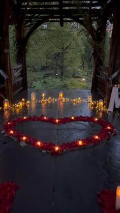 candles are arranged in the shape of a heart