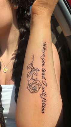 a woman's arm with a rose tattoo on it that says, i love you