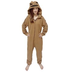 a woman in a brown animal onesuit is standing with her hands on her hips