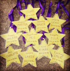 some yellow and purple stars with names on them