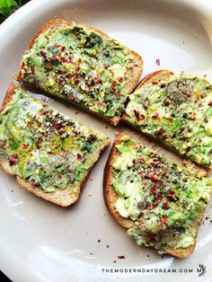 four pieces of bread with various toppings on them