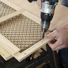 a person using a drill to cut wood