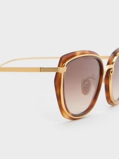 To make a tasteful statement, reach for these tortoiseshell sunnies. Geometric frames create an angular silhouette that will enhance your best facial features. As an edgy, eye-catching detail, the tortoiseshell finish is paired with high-shine metallic rims. Made with durable stainless steel, they will provide sun protection while looking chic at the same time. Size Chart For Kids, Facial Features, Charles Keith, Sunglasses & Glasses, Sunglass Frames, Tortoise Shell, Belt Size, Sun Protection, Comfortable Shoes