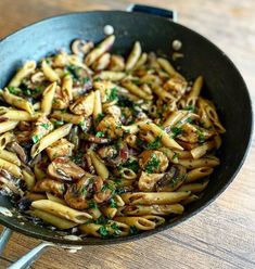 pasta with mushrooms and parsley in a skillet