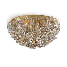 a gold ceiling light with crystal flowers on it