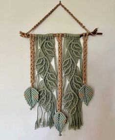 a wall hanging made out of macrame and rope