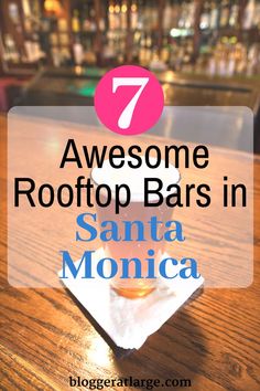 a wooden table with the words 7 awesome rooftop bars in santa monica