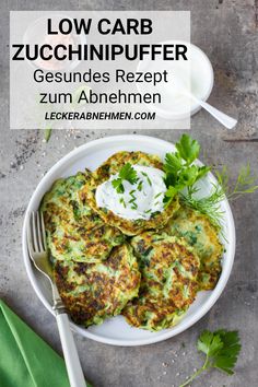 low carb zucchini fritter on a white plate with a fork