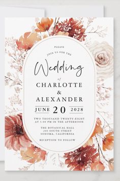 an elegant wedding card with flowers on it