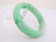 Vintage Translucent Natural Green, White Jadeite Jade Oval Bangle Bracelet ...Total of weights 73.9grams...Measure inside 59.04MM ( 2 2/8'' inches ) W 16.93MM...It's in very good condition. The bangle come with CERTIFICATE PNJ 94056 Lot #12 Green Bangle Crystal Bracelet For Formal Occasions, Green Crystal Bangle Bracelet For Formal Occasions, Oval Bangle, Vintage Bangle Bracelets, White Opal Ring, Carved Ring, Topaz Engagement Ring, Vintage Bangles, Lapis Lazuli Ring