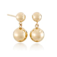 Our gold earrings offer a graceful cascade of warmth, their dual beads dancing with light for a quietly captivating effect. Since 1861, Gump's has been a destination for jewelry that is distinctive, extraordinary and timeless. Featuring only the finest materials, each piece is a statement of elegance. 14-karat yellow gold beads, 6mm and 9.5mm. Pierced only. 5/8" long. Formal Polished Sphere Earrings, Formal Round Polished Earrings, Formal 14k Gold Earrings With Timeless Design, Timeless Design Round Earrings For Gift, Classic 14k Gold Earrings With Timeless Design, Elegant 14k Gold Earrings With Timeless Design, Elegant Yellow Gold Dangle Cluster Earrings, Elegant Yellow Gold Cluster Dangle Earrings, Gold Earrings With Timeless Design For Fine Jewelry