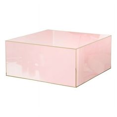 a pink box sitting on top of a white surface