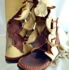 **TURNAROUND TIME IS CURRENTLY 2-4 MONTHS FOR ALL OF OUR MOCCASINS** If you need them more quickly, send us a message and we will let you know if we can make it work. Our Woodland Owl Calf High Elf Wrap is made for nature lovers, woodland hikers, and those stargazers listening to the owls hoOOootie whoOooOoo in the night. It comes with a Sand colored heel with an amazing owl (or something of your choice?) etched into the back of one boot, chocolate Brown toe, and a Tobacco sole. The laces are ma Woodland Fairy Costume Shoes, Moccasin Boots Fairy, Fantasy Leaf Shoes, Cosplay Faun Shoes, Elf Inspired Shoes, Leave Shoes, Knee High Moccasins, Woodland Faerie, Owl Shoes