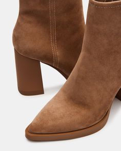 Introducing our HARDEN ankle bootie. Expertly crafted with a pointed toe, this bootie offers a sleek and stylish look. The block heel provides comfortable support for all-day wear, while the inside zipper allows for easy on and off. Step out in style with these must-have booties. 3.75 inch heel height Size 6 measurements: 10 inch shaft circumference, 5 inch shaft height Size 8 measurements: 10.75 inch shaft circumference, 5.25 inch shaft height Size 10 measurements: 11.5 inch shaft circumference, 5.5 inch shaft height Suede upper material Textile and synthetic lining Synthetic sock Synthetic sole Imported Fall Ankle Boots With Sculpted Heel, Fall Ankle Booties With Sculpted Heel, Fall Booties With Suede Lining And Pointed Toe, Fall Pointed Toe Booties With Suede Lining, Fall Mid-calf Boots With Suede Lining And Pointed Toe, Ankle Bootie, Womens Boots Ankle, Platform Boots, 10 Inch