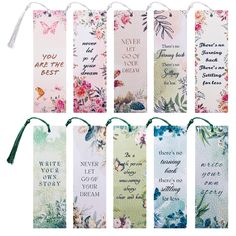 six bookmarks with flowers and words on them, each one has a string attached to it