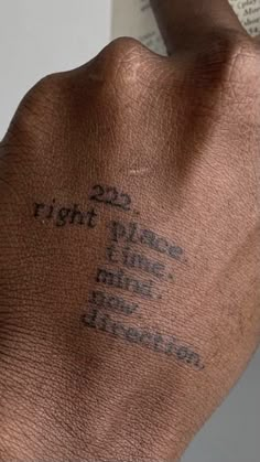 a close up of a person's hand with writing on it