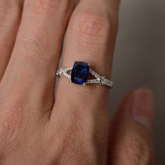 This is a gorgeous handmade creation. Its beauty is its simplicity & Elegance. The 6*8mm cushion cut lab sapphire is crafted in sterling silver with rhodium plated. It's made to order and it will take about 7-10 days to make it. All item is sent in a beautiful gift box You can realize more lovely stuff clicking the link https://www.etsy.com/shop/knightjewelry?refshopsection_shophome_leftnav Please leave the correct address and you phone number for delivering successfully. Sapphire Ring Silver, Blue Sapphire Engagement Ring, Sapphire Engagement Ring, Split Shank, Ring Promise, Sapphire Engagement, Beautiful Gift Boxes, Ring Silver, Cushion Cut