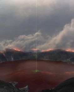 a red crater surrounded by mountains under a cloudy sky with green light coming from the top