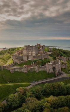 an aerial view of a castle on top of a hill