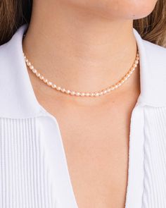 Customize the classic pearl necklace with your choice of peach, purple, or white genuine freshwater pearls for a subtle luster sure to brighten up any outfit. Naturally tinted, this necklace pairs great with dainty golden chains and pearl earrings to tie up your look. Pearl Necklace With Delicate Round Beads, Feminine Single Strand Jewelry With Round Beads, Feminine Single Strand Round Beads Jewelry, Feminine Pearl White Single Strand Jewelry, Rose Gold Pearl Chain Necklace, Feminine Single Strand Pearl White Jewelry, Feminine Single Strand Pearl Jewelry, Feminine Single Strand Pearl Necklace, Feminine Pearl Charm Jewelry With Round Beads