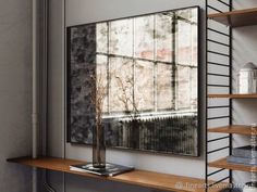 an empty shelf with a vase on it in front of a large mirror and bookshelf