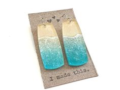 "Love these beach themed dangle earrings!  You will get so many compliments when you wear these!   The rectangle shape is about 50 mm long (2\") and 22 mm wide.  The ear wires are either solid sterling or surgical steel--your choice.  The earrings are lightweight. They are made of clear plastic resin. Please take these earrings off when jumping in water.  They are water resistant, but will last longer if kept out of being drenched by water." Rectangular Summer Earrings As Gift, Summer Waves, Light Weight Jewelry, Beach Earrings, Plastic Resin, Cute Packaging, Ocean Beach, Organza Bags, Rectangle Shape