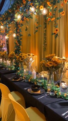 a long table is set with flowers and candles for an elegant dinner or banquet event