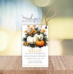 a card with pumpkins and flowers on it