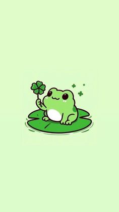 a cartoon frog sitting on top of a green leafy surface with clovers in its mouth