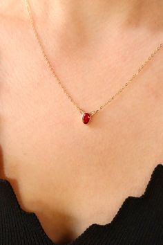 Elevate your style with this exquisite 14K gold necklace featuring a captivating red gemstone pendant. The deep, rich hue of the ruby exudes timeless beauty, making it a perfect accessory for various occasions. Handcrafted with precision, this chic and stylish necklace adds a touch of sophistication to any ensemble. Whether you're attending a special event or simply want to enhance your everyday look, this red stone jewelry is a symbol of classic charm and enduring elegance. Key Features: Material: 14K Gold Dazzling ruby gemstone pendant Handcrafted for a unique touch Classic and timeless design Perfect for any occasion Classic Red 14k Gold Necklace, Red Oval Pendant Necklace With Birthstone, Red 14k Gold Birthstone Necklace, Red Round Pendant Necklace Fine Jewelry, Red Birthstone Necklace In Fine Jewelry Style, Fine Jewelry Red Birthstone Necklace, Red Round Pendant Necklace In Fine Jewelry, Red Round Pendant Birthstone Necklace In Fine Jewelry Style, Ruby Oval Pendant Necklace For Gift