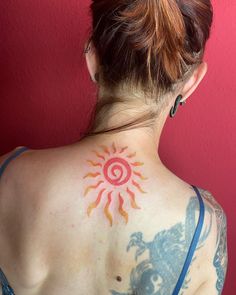 a woman with a tattoo on her back