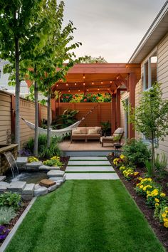 Backyard with a pergola, hammock, outdoor seating, string lights, garden bed, and stone pathway. Pergola In Small Backyard, Extra Small Backyard Ideas, Small Backyard With Pergola, Small Backyard Spaces Ideas, Garden Zones Ideas, Small Backyard Turf Ideas, Small Backyard Ideas On A Budget Diy Simple Garden Design, Landscape Small Backyard, Small Pergola Ideas Backyards