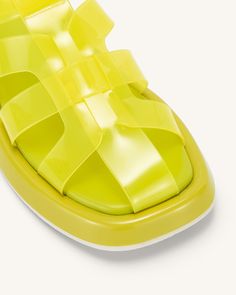 Spring Jelly Sandals With Rubber Sole, Flat Rubber Sole Jelly Sandals For Summer, Flat Jelly Sandals With Rubber Sole For Summer, Summer Flat Jelly Sandals With Rubber Sole, Summer Jelly Sandals With Rubber Sole, Flat Sandals With Translucent Outsole For Beach, Beach Sandals With Translucent Outsole, Modern Flat Jelly Sandals For Summer, Modern Jelly Sandals With Round Toe For Beach