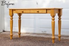 a wooden table sitting in front of a garage door with the words before written on it