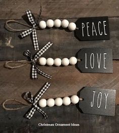 three tags with words on them that say peace, love and joy