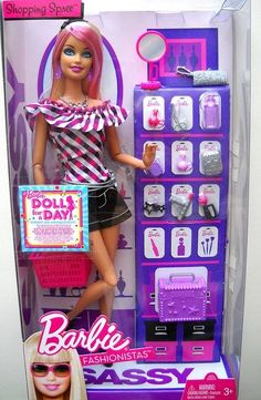 a barbie doll with pink hair and sunglasses holding a shopping cart in front of a display case