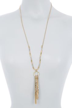 - Rolo chain necklace with semi-precious beaded details and a drop chain wrapped tassel. . Lobster clasp . Approx. 30" necklace with 2" extension . Approx. 4" tassel drop . Imported  Plated brass, semi-precious beads Gold Tassel Necklace For Party, Gold Beaded Dangle Tassel Necklace, Gold Tassel Dangle Necklace, Long Metal Tassel Necklace With Chain, Gold Beaded Tassel Long Necklace, Metal Long Tassel Necklace, Gold Beaded Tassel Necklace, Long Metal Tassel Necklace, Gold Lariat Tassel Necklace