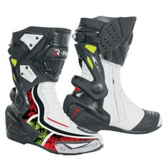 a pair of white and black motorbike boots