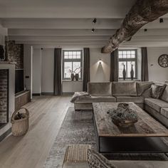 a living room filled with furniture and a fire place