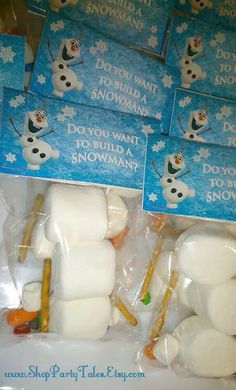 marshmallows are wrapped in cellophane to look like snowmen and the words do you want to build a snowman?