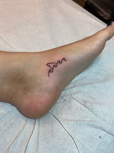 a person with a small tattoo on their foot