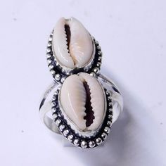 Weight of ring 5.5 Gm Head Sell Size 11x33 mm (APPROX.) 100% Cowrie shell natural stone, Metal:Sterling Silver Stamped:925 i make jewelry for a very special kind of Women's men's ,This stunning is handcrafted by one of our talented artisans. It is set in precious Fine Jewelry 925 Sterling Silver Jewelry, Polished to a brilliant luster> You can also contact us for a separate order, or place an order? Send items back within: 30 days of delivery Request a cancellation within: 2 Hours of purchase White Rings Suitable For Summer Gifts, White Rings For Summer Gifts, Handmade Silver Round Shell, Handmade Oval Jewelry For Beach, Vintage Handmade Rings For Summer, Vintage Handmade Summer Rings, Silver Shell Rings For Beach, Silver Shell-shaped Rings For Beach, Silver Shell-shaped Ring For Gift