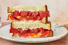 two halves of a sandwich with strawberries on toast