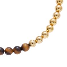 The Irish Coffee necklace from our Aperitivo Collection is sure to leave you in high spirits. This refreshing necklace features walnut semi-precious stone beads with an accent of gold-plated brass beads mixed in to add a stylish undertone that works perfectly with layered necklaces or worn on its own. Measurements: 16 " long, 2 " extension. Materials: Semi-precious stone, 24K gold-plated brass. Pair with: Peach Bellini. All Ben-Amun jewelry is handcrafted and made to order in NYC; please allow 7 Gold Gemstone Beads Necklace, Gold Gemstone Beaded Necklaces For Layering, Everyday Gold Beaded Necklace With Natural Stones, Coffee Necklace, Peach Bellini, High Spirits, Brass Beads, Irish Coffee, Layering Necklace