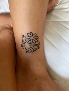 a woman's leg with a tattoo on her left arm and the word love written in black ink