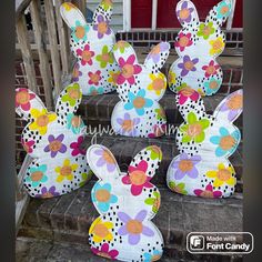 easter bunnies made out of cardboard are sitting on the steps