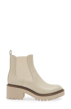 A classic Chelsea boot is remixed in this leather version that's boosted by a hardy lug platform and block heel. 2 1/2" heel; 1 1/4" platform (size 8.5) 5 1/2" shaft Pull-on style with elastic gore insets Water-resistant Leather upper/synthetic lining/rubber sole Imported Chic Cream Boots With Lug Sole, Cream Platform Boots With Block Heel, Fall Beige Platform Boots With Lug Sole, Beige Platform Boots With Lug Sole For Fall, Beige Ankle-high Boots With Lug Sole, Cream Platform Boots For Fall, Cream Leather Boots With Lug Sole, Beige Leather Platform Boots With Block Heel, Beige Almond Toe Boots With Lug Sole