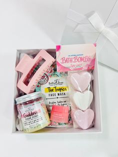 a box filled with pink and white items